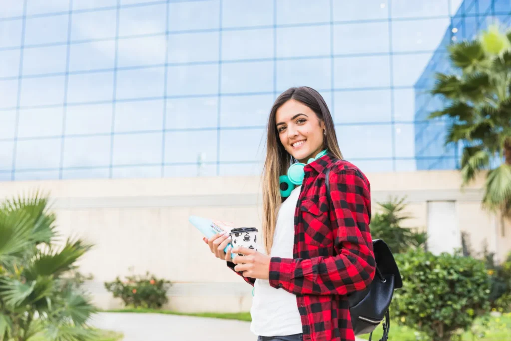 international-student-preparing-to-study-in-malaysia-outside-a-modern-university-building